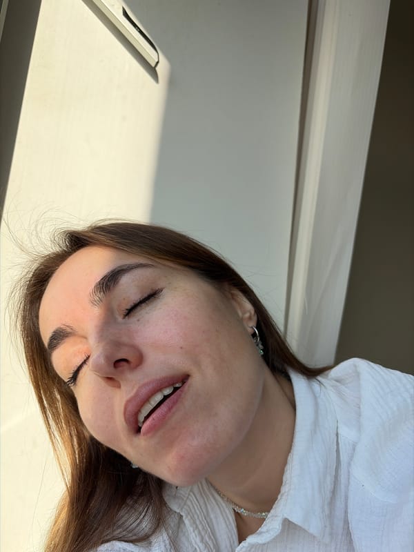 Woman photographed in multiple poses near window in Izhevsk