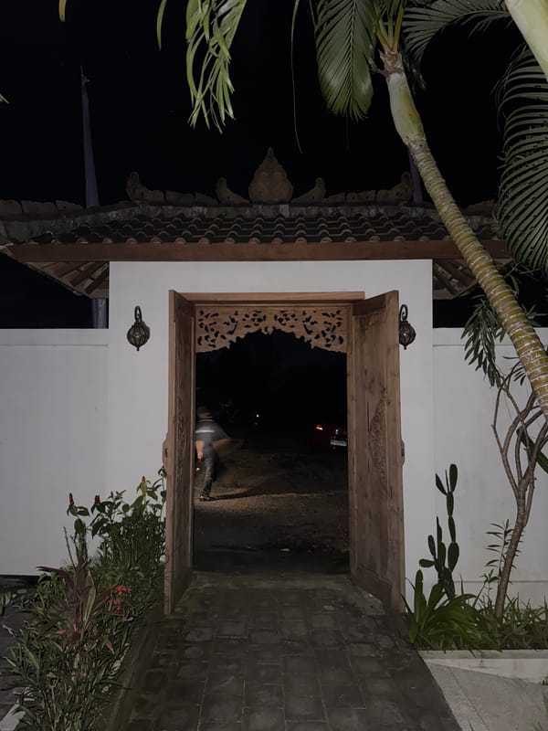 Nighttime scene documented at building entrance in Ungasan, Indonesia