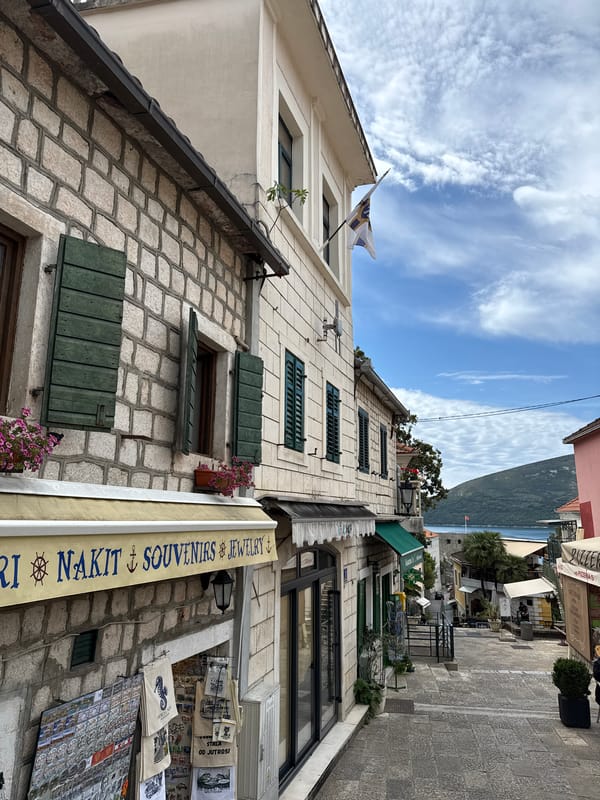 Tourist documents morning walk through historic Herceg Novi Old Town