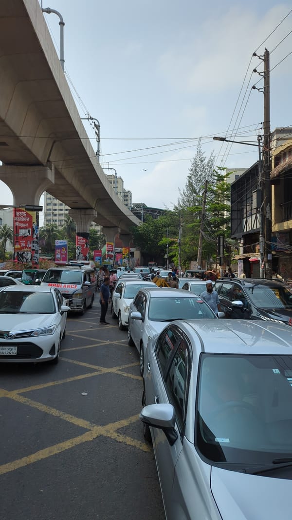 Motorcyclists queue for fuel at Dhaka gas station