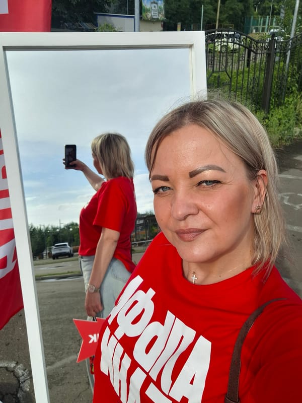Woman documents Alpha Bank promotional event in Birobidzhan