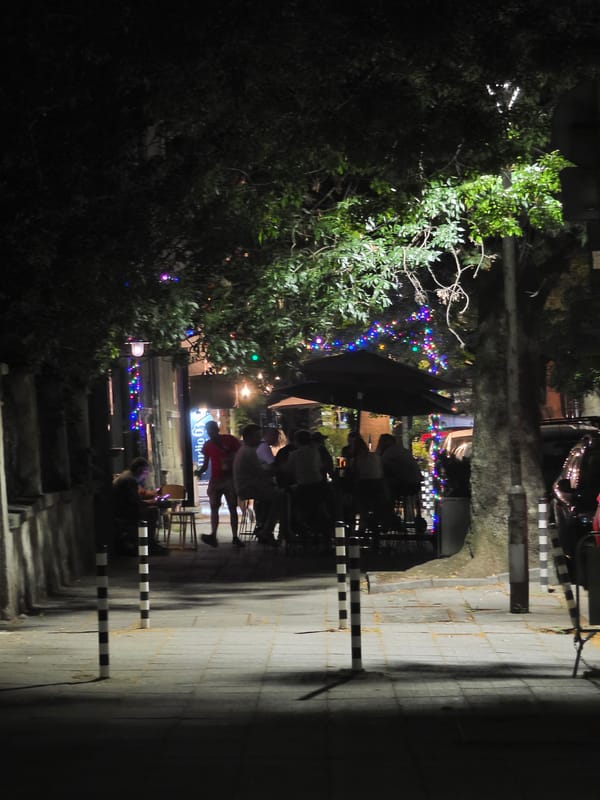 A quiet Sofia neighborhood at night, streets still wet from rain