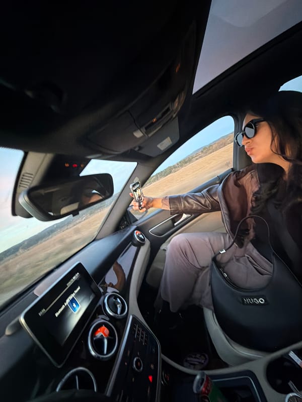 Woman with phone photographed in driver's seat in Bulgaria