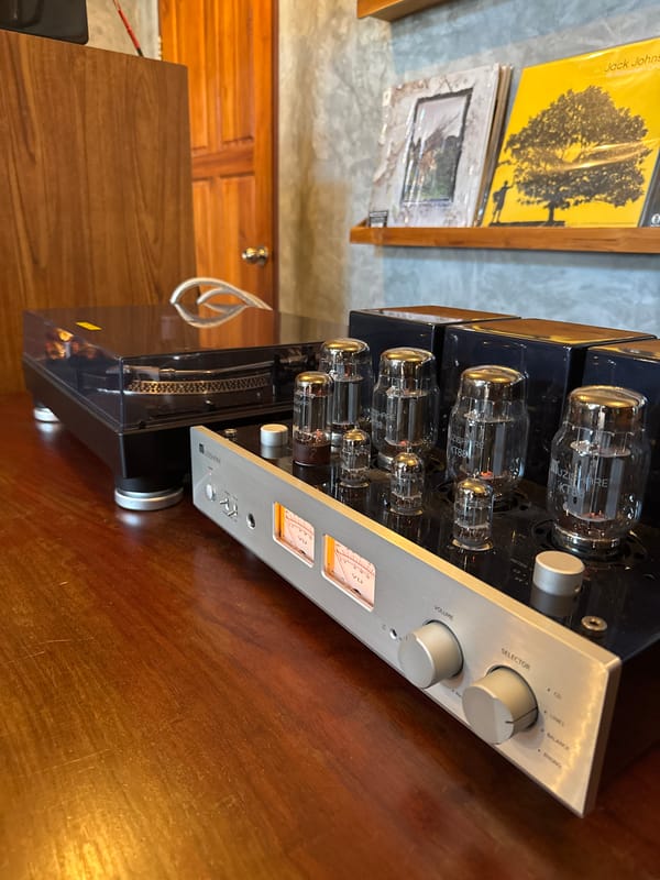 Morning documentation of home audio setup and tropical surroundings