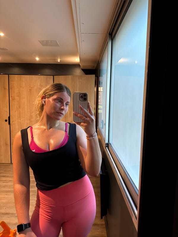 Woman takes post-workout selfie at Paris gym facility