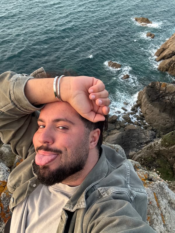 Tourist captures sunset, coastal views in Saint-Malo during evening visit