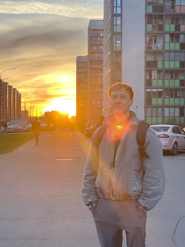 Golden sunset illuminates street scene in Murino, Russia