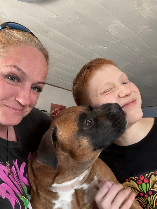 Family shares quiet moment with pet dog in Chaikovsky