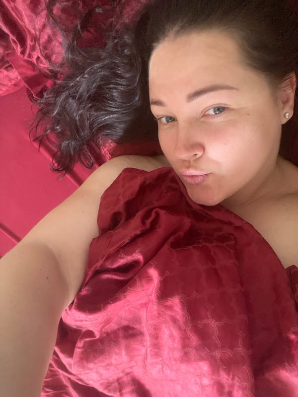 Woman photographed with peonies and coffee in Sochi bedroom