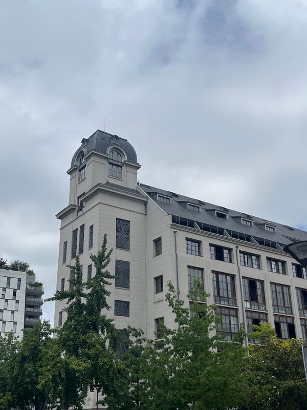 Paris street-level mix: classic facades, canoe sculpture, ornate fountains