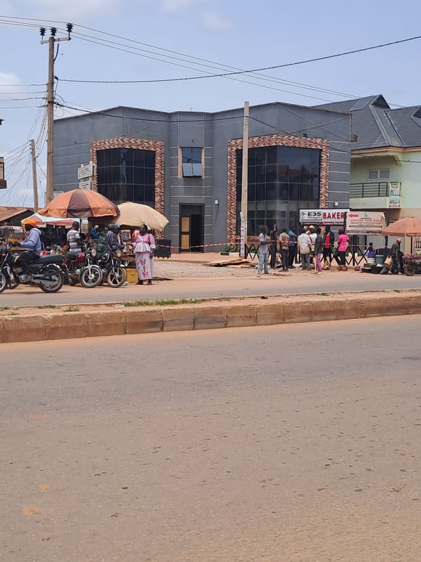 Morning street life in Sabon Tasha, Nigeria, with a sun halo overhead