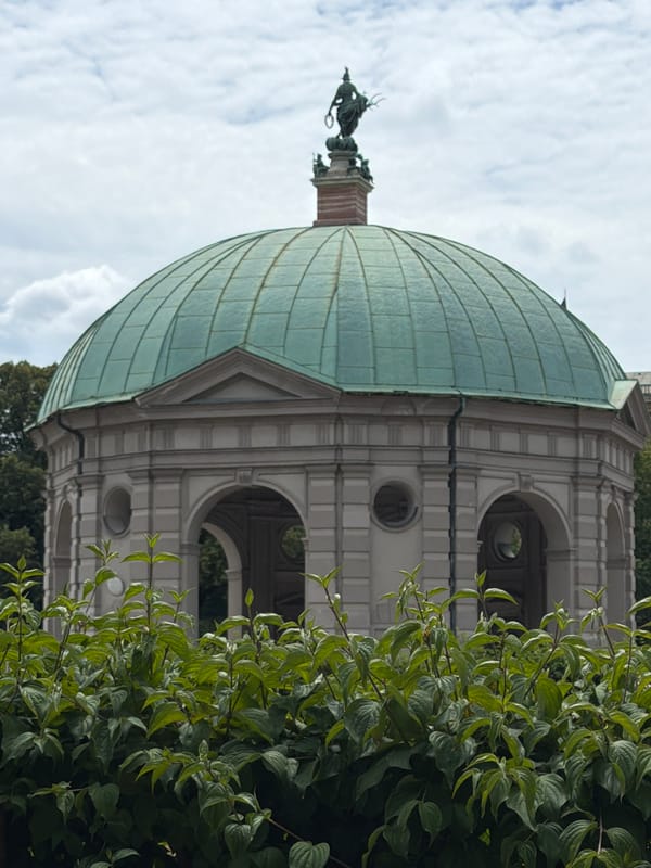 Munich skyline and Englischer Garten landmarks on a cloudy day