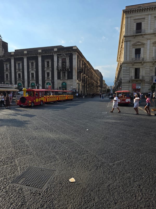 Tourist train rolls through Catania's Piazza del Duomo