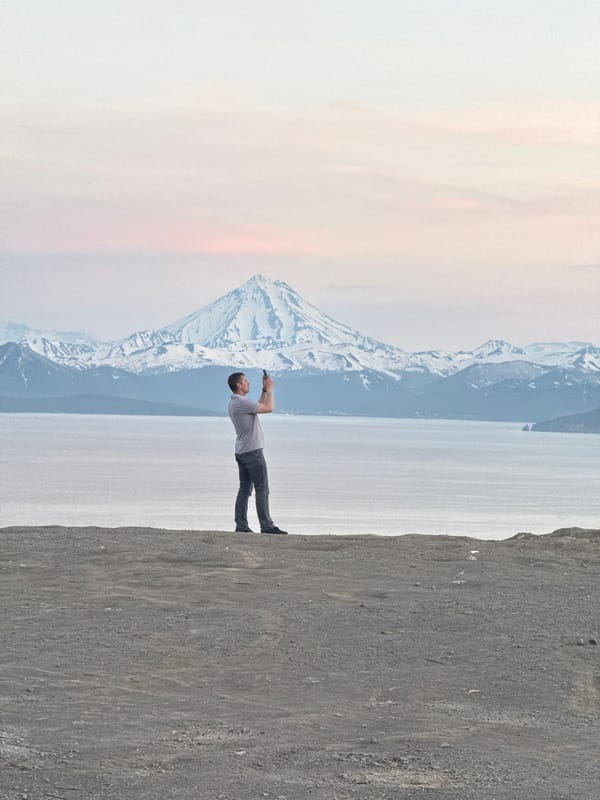 Taking in Kamchatka's volcanic landscape from a dirt bluff