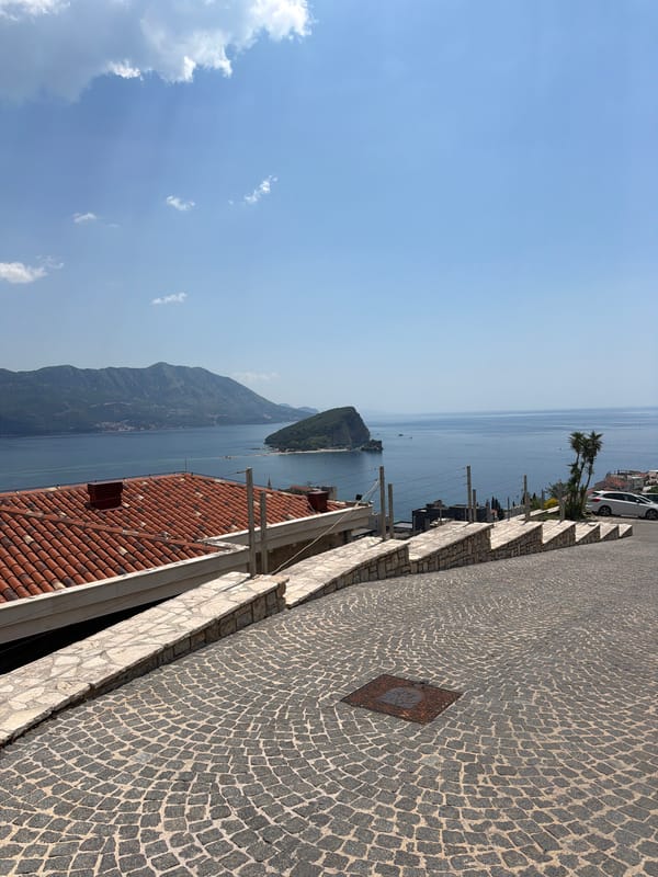 Tourist documents morning exploration of Budva, Montenegro coastline