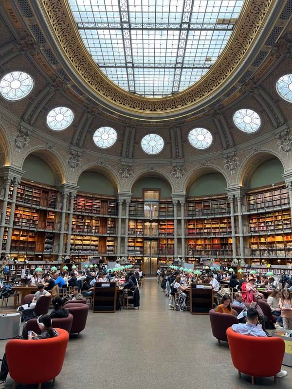 Parisians study in historic library reading rooms beneath glass domes