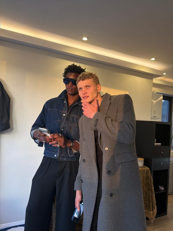 Two men spotted in London room, one with smartphone