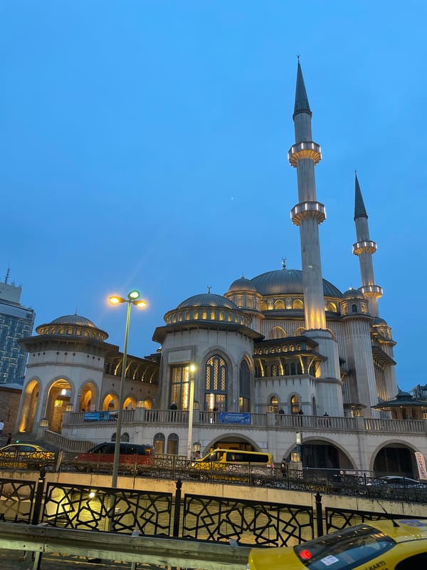 Mosque illuminated at dusk in Beyoğlu, Turkey