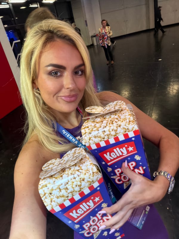 Woman takes selfies with popcorn boxes in Vienna