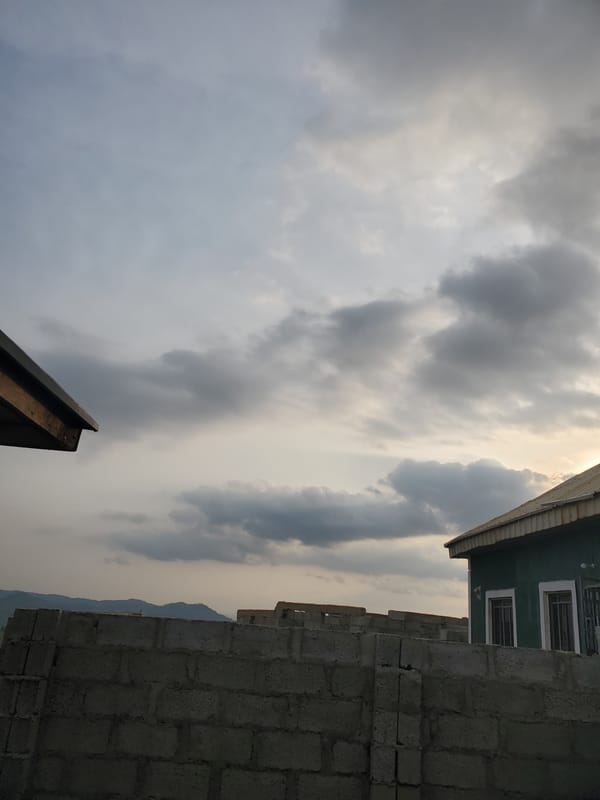 Suleja outskirts at dusk: construction site meets open landscape