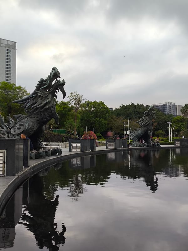 Dragon statues and fountains captured in Longgang District park