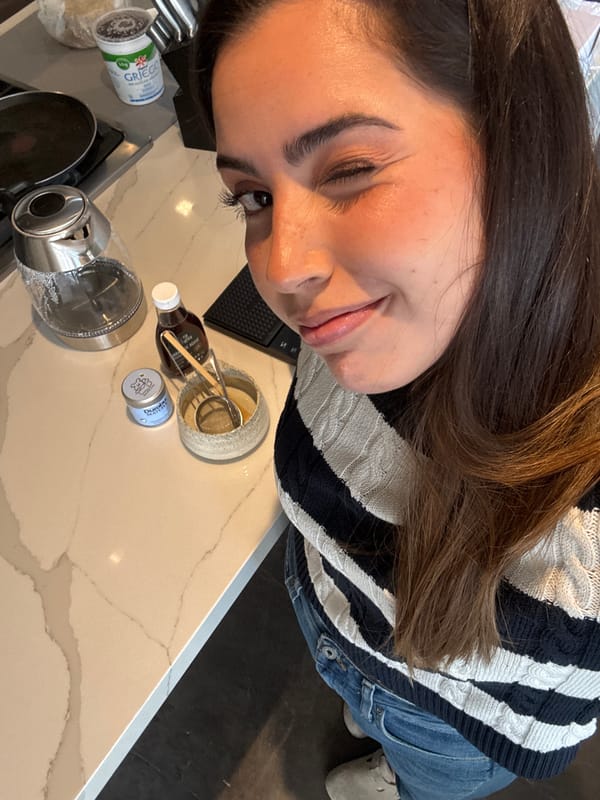 Woman prepares matcha drink in Mexican kitchen late evening