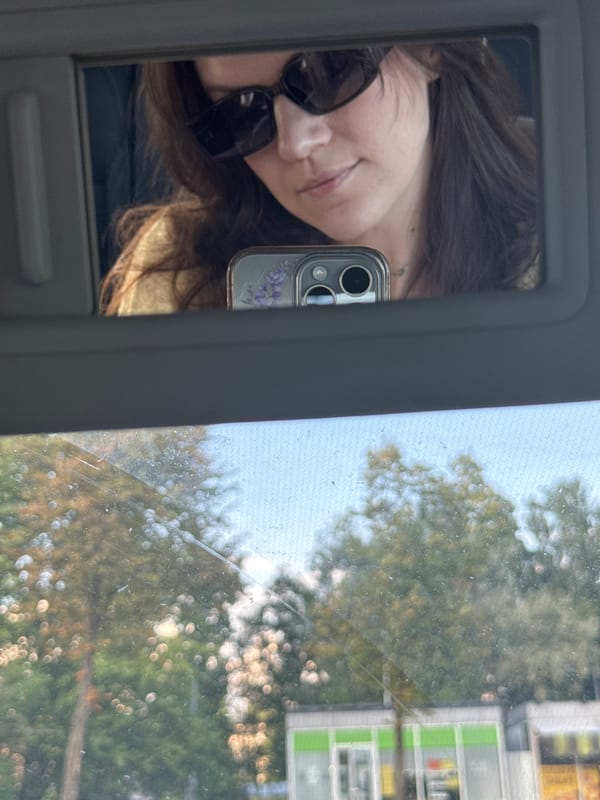 Sun visor mirror selfie in a parked car, Saint Petersburg