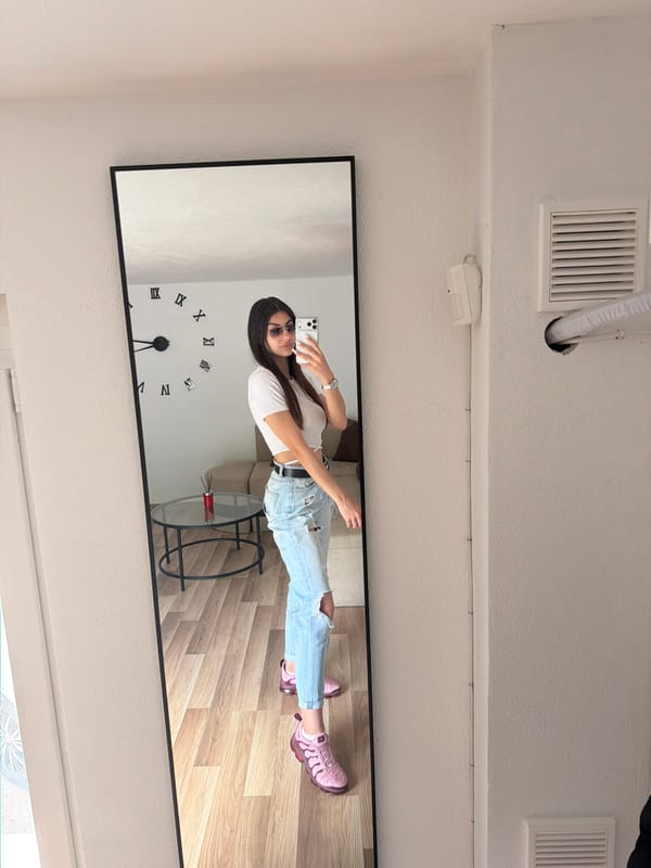 Woman Takes Mirror Selfies in Gabrovo Interior Space