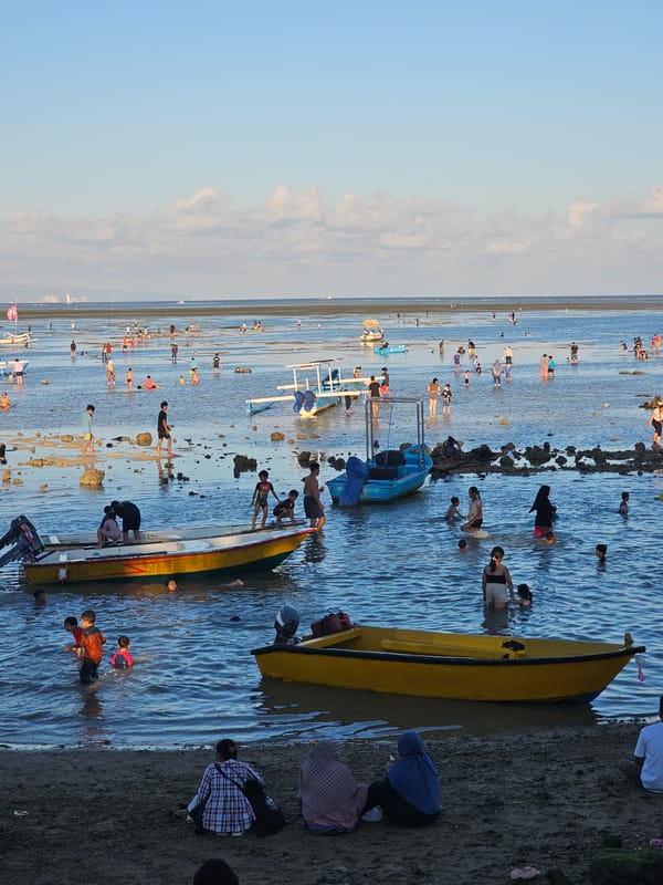 Busy morning at Sanur Beach during low tide