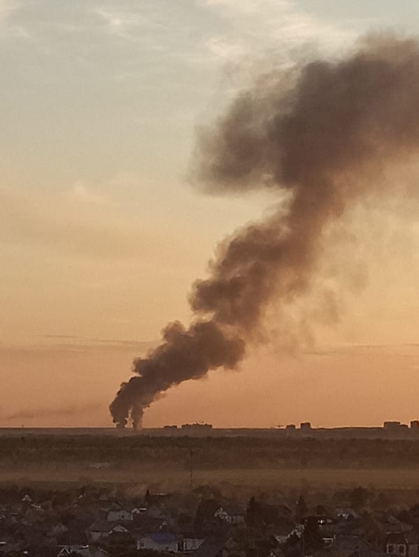 Dark smoke plume rises over Kondratovo village, Russia