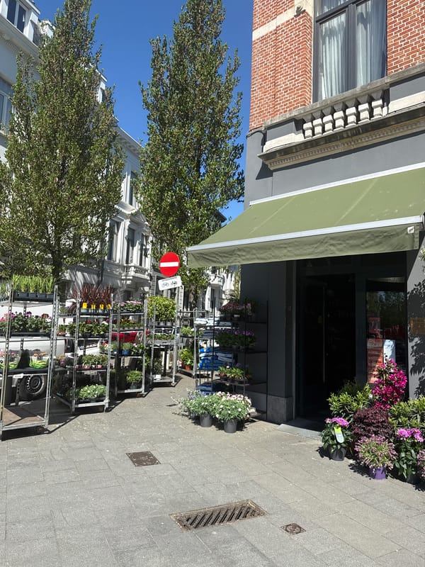 Woman spotted outside Antwerp flower shop with beverage and IQOS