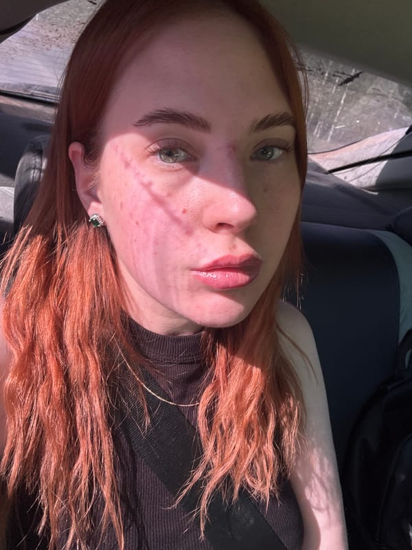 Woman with red hair photographed in car in Starobaltachevo