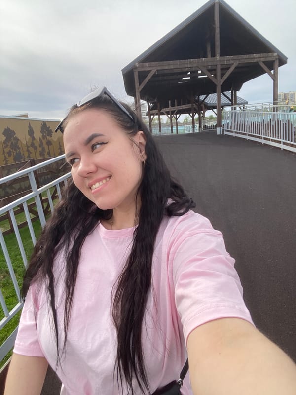 Woman selfie, bird sighting near pond in Perm