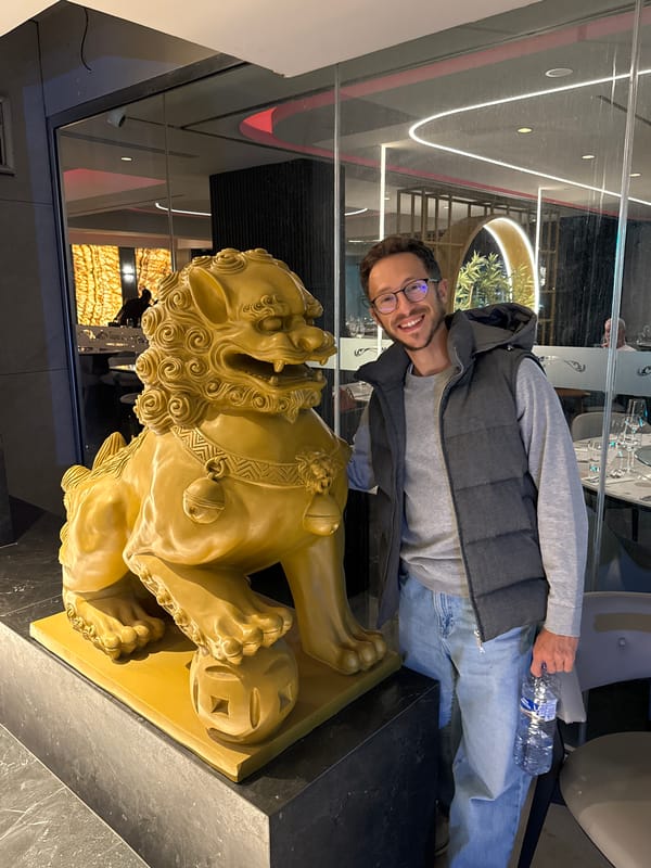 Man photographed with golden lion statue in Larnaca
