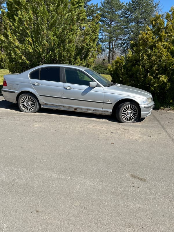 Worn BMW sedan spotted parked in Dichin, Bulgaria
