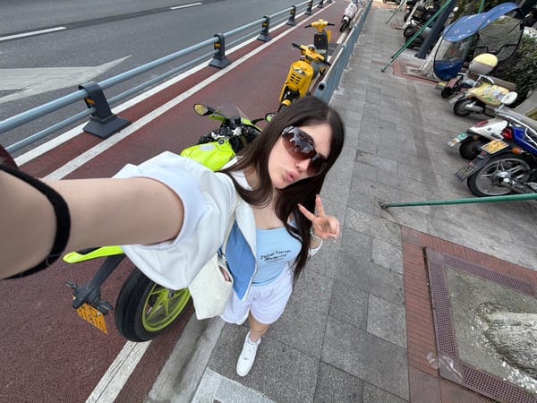 Couple photographs kitten during morning outing in Chongqing tech district