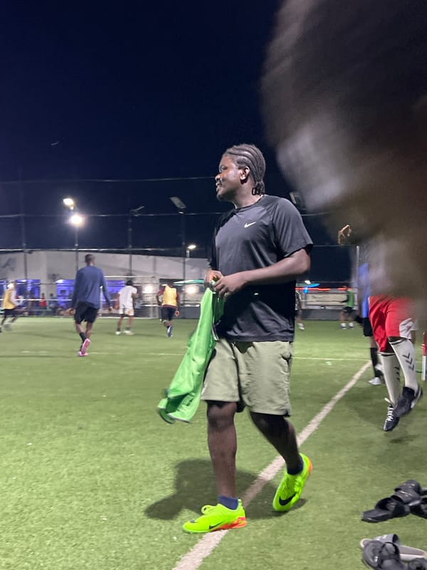 Nighttime soccer match documented on floodlit field in Jalingo