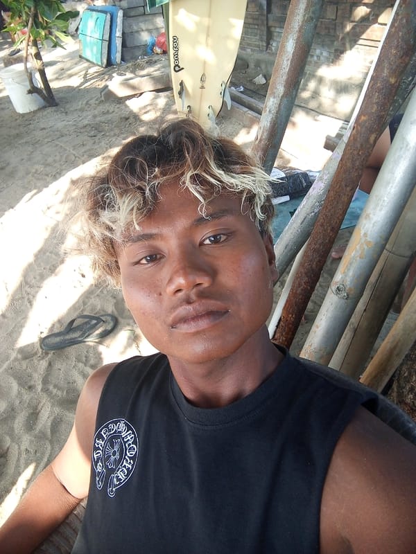 Kuta Beach morning: surf, vendors, and everyday beach life