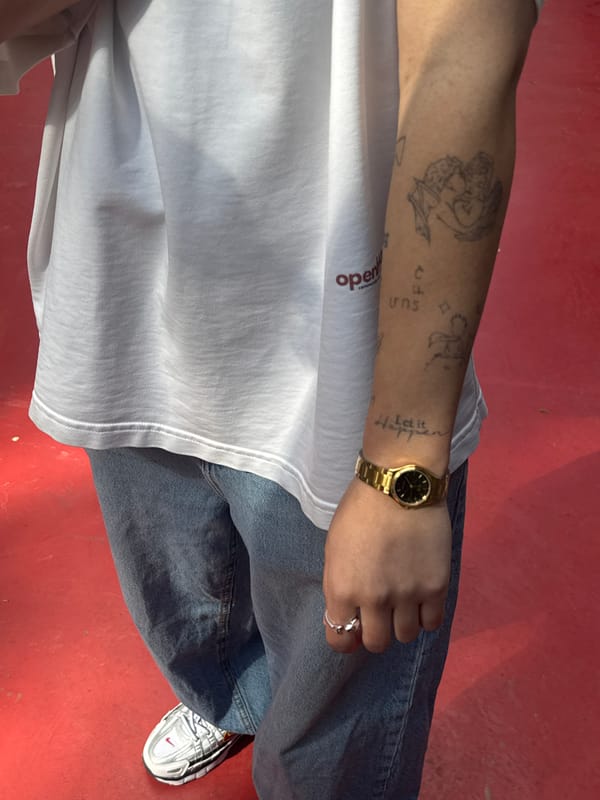 Tattooed individual in casual wear photographed in Yerevan