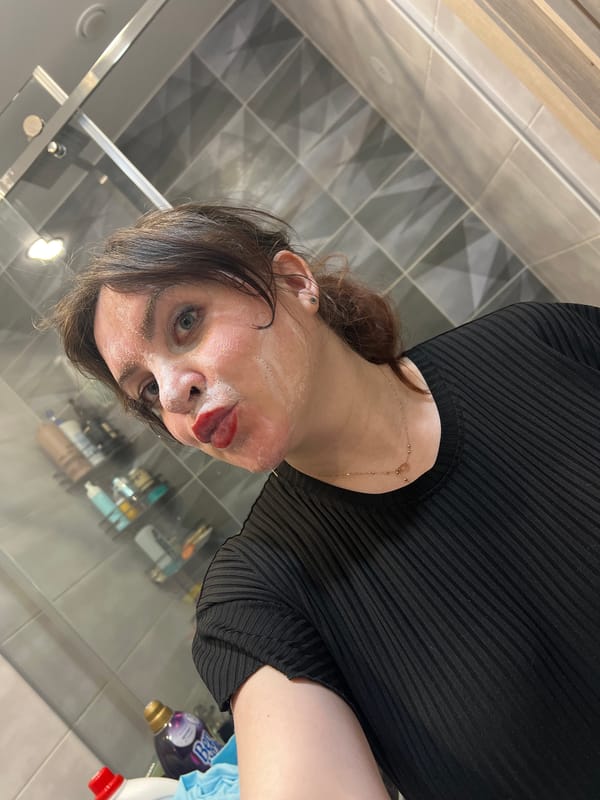 Women photograph casual gathering with cat in Russian apartment