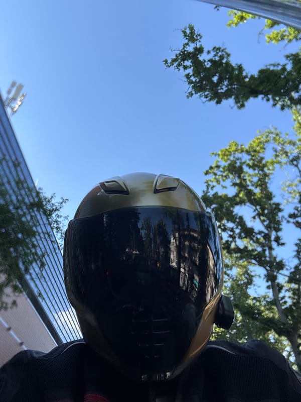 Motorcycle helmet photographed showing building reflections in Plovdiv
