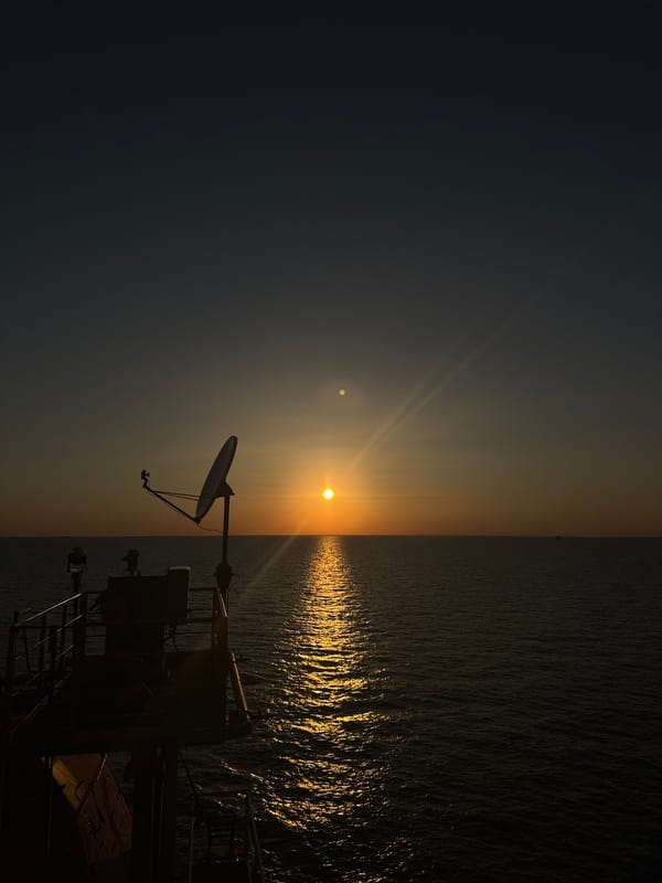 Offshore drilling platform at golden hour, Italian waters