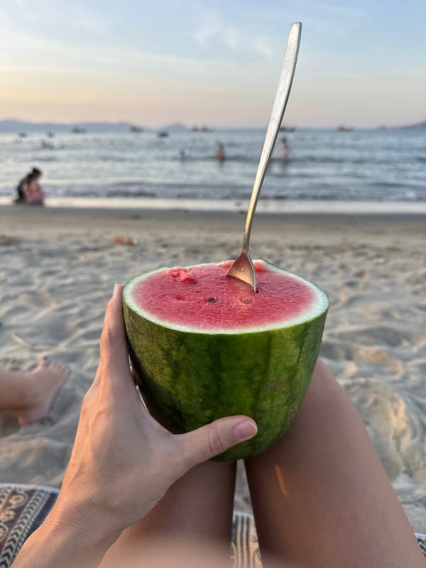 Watermelon on the sand, sunset over Da Nang beach