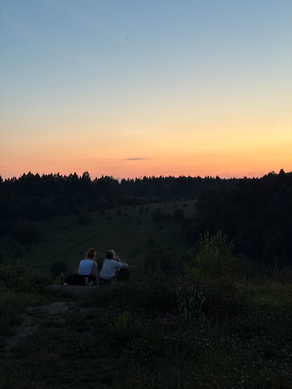 Sunset hang on a hilltop overlooking Krasnogorsk's forested valley