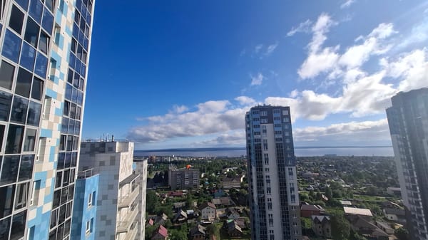 Aerial sweep over Petrozavodsk's mix of housing and high-rises