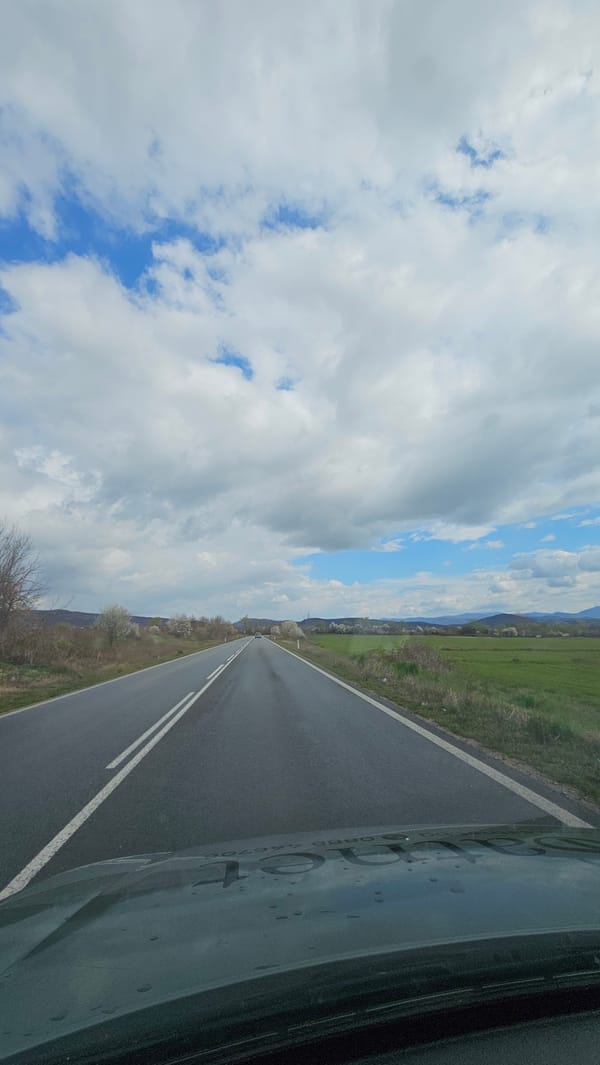 Vehicle travels paved road in Vasil Levski, Bulgaria
