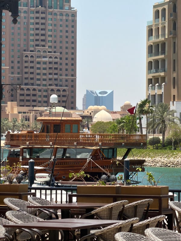 Urban waterfront district with boats, fountains captured by witnesses