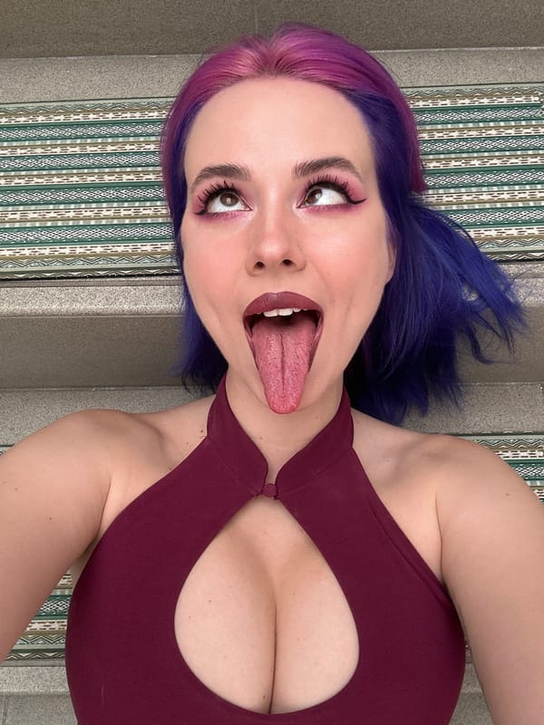 Woman with colorful hair poses on Zagreb stairs
