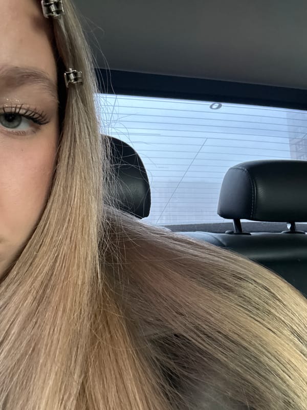 Close-up portrait captured in Saint Petersburg showing blonde hair styling