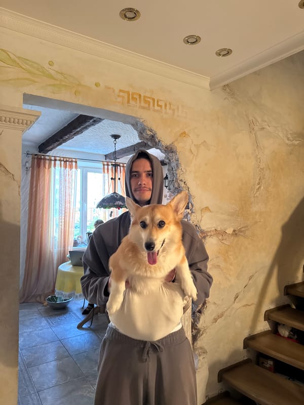 Man carries corgi through ornate building in Sevastopol